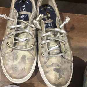 Girls metallic gold sperry sneakers.